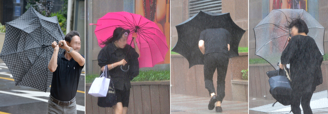 한반도를 관통해 북상한 제6호 태풍 '카눈'의 영향으로 강한 비바람이 몰아친 10일 울산 도심을 지나는 시민들이 우산을 부여 잡고 힘겹게 발길을 옮기고 있다. 유은경기자 2006sajin@